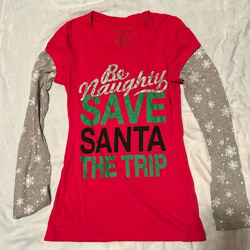Wound up Christmas t shirt. “Be naughty. Save Santa the trip”